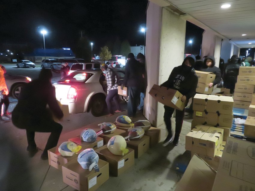 Volunteers at the LMTS Community Center in south Lansing distributed more than 500 turkey dinners the Monday before Thanksgiving.