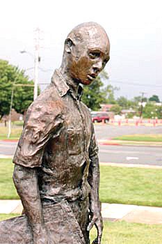 Terrance Roberts and the statue that depicts him in Little Rock, Ark.